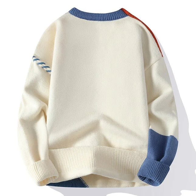 White sweater with blue and red accents on a white background