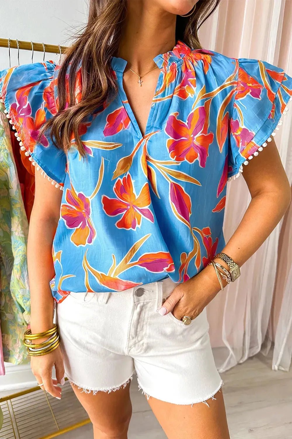 Floral Flutter Sleeve Blouse with Pompom Trim.