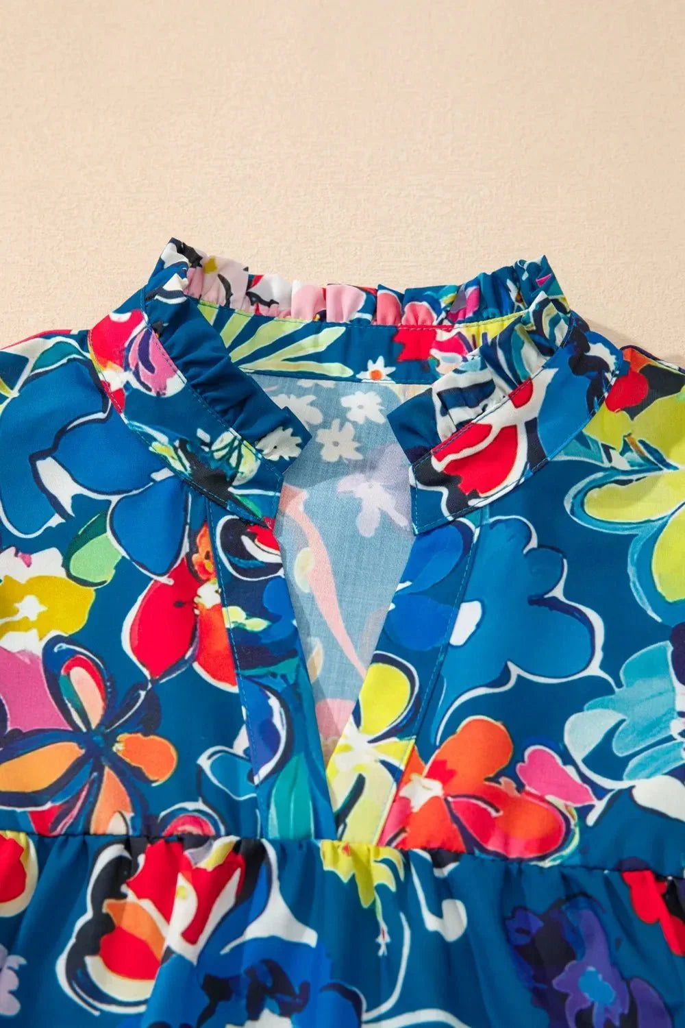Flowy Floral Blouse with Ruffle Sleeves.