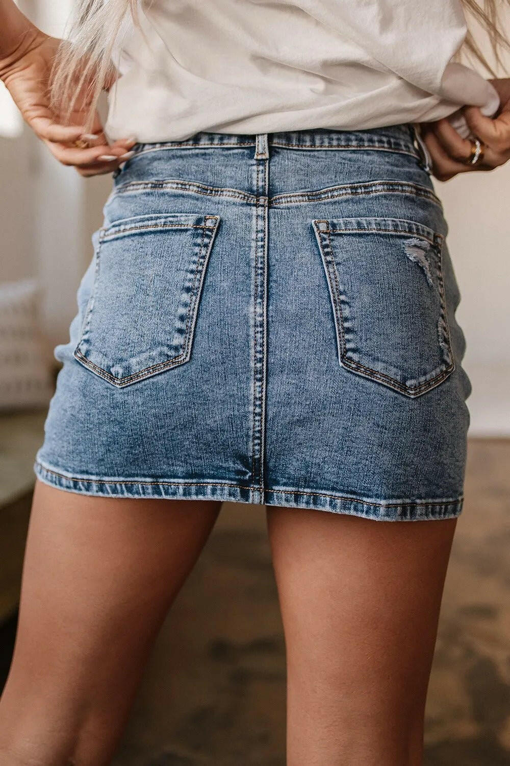 Rhinestone Distressed Denim Mini Skirt.